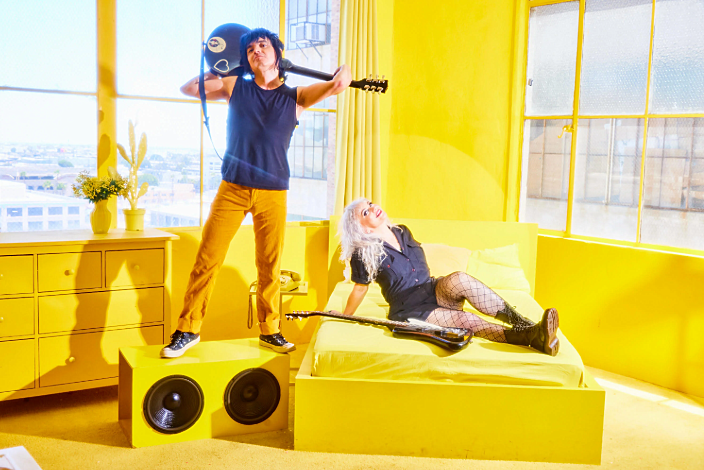 The Dollyrots in a bright yellow room