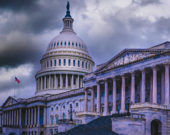 US Capital Bldg with clouds above it