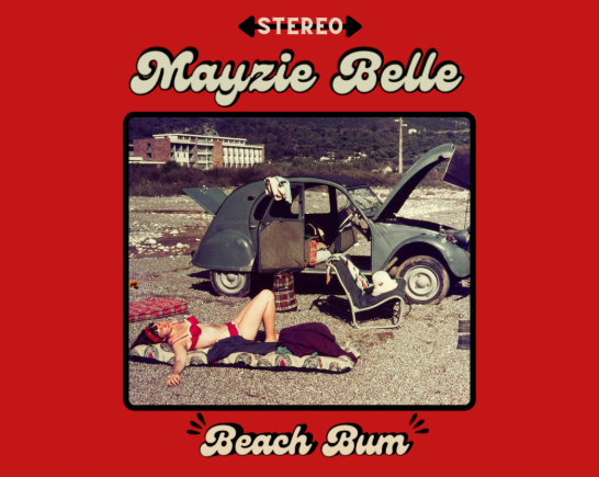 A woman in a red swimsuit sunbathes on a beach. A vintage Volkswagon Beetle is in the background