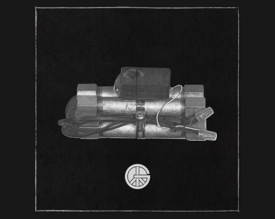 A silver pipe bomb centered on a black background with the letter G symbolizing LA Band Gottlieb