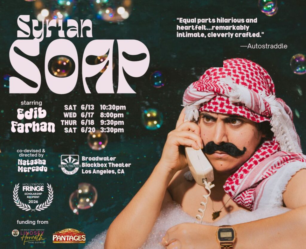 a man in a white sleeveless shirt, a dark mustache wears a red and white keffiyeh holds a white phone receiver to his ear. In the background there are bubbles and the words Syrian Soap