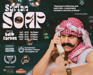 a man in a white sleeveless shirt, a dark mustache wears a red and white keffiyeh holds a white phone receiver to his ear. In the background there are bubbles and the words Syrian Soap