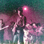 Mod Rock Band The Question plays under pink lighting