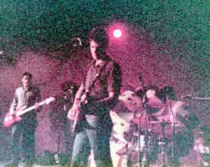 Mod Rock Band The Question plays under pink lighting