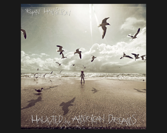 A sepia toned image of a young girl walking on a beach with clouds on the horizon and seabirds flying overhead
