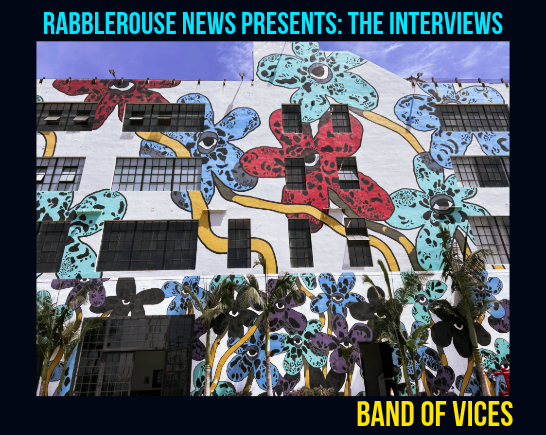Front of gallery building in DTLA with bright flowers painted on white brick