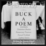 Table draped with white tablecloth has typewriter and sign that says "Poems $1" A leg with white ankle high socks and a black and white sneaker sticks out from beneath the table cloth