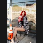 Monique Powell of SAVE FERRIS sits on a bench drinking a Big Gulp