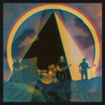 A psychedelic Image of a pyramid with an rainbow arch above it with the rock band Gale Forces standing at the base