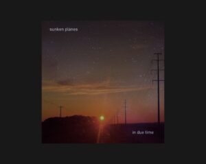 A midwestern sunset at twilight with stars in the sky and setting orange sun