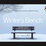 A winter scene of an empty park bench dusted with snow beneath a leafless tree.