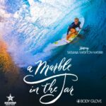 Pro female surfer Tatiana Weston-Webb rides a giant wave